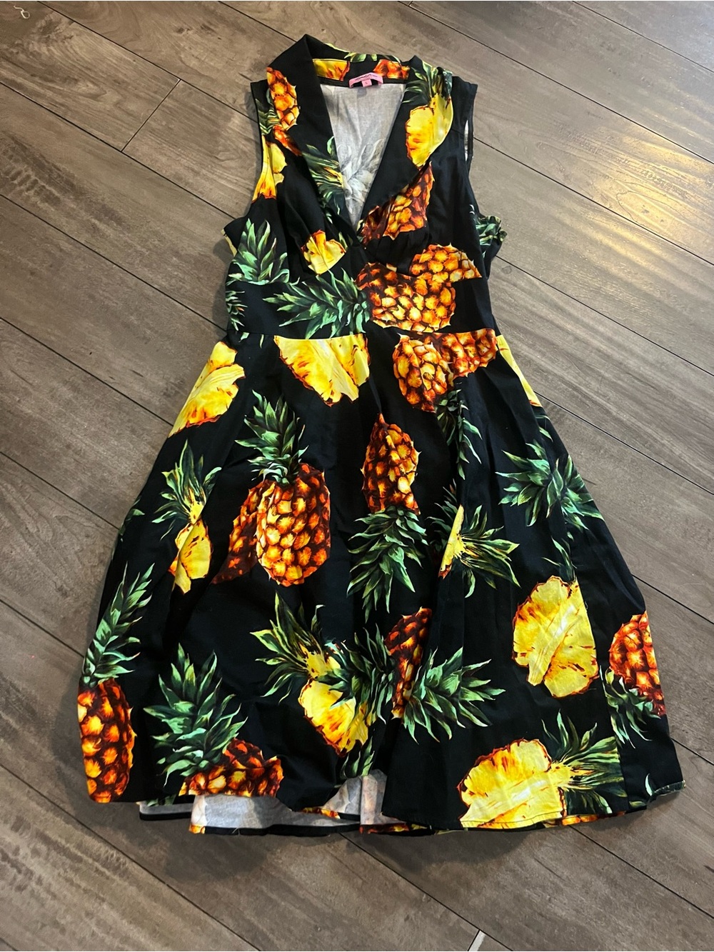 Rebel Love pineapple pin-up dress in Black with Vibrant Orange & Green Print